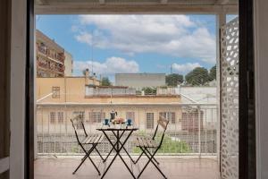a view of a balcony with a table and two chairs at Garibaldi 54 in Bari