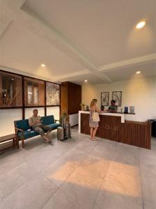 a man and a woman standing in a living room at Casa Kandara in Waingapu +46 photos
