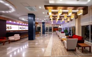 a lobby of a hotel with couches and chairs at Solivia hotel in Alanya +76 photos