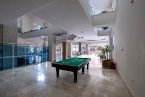 a pool table in the middle of a room at Solivia hotel in Alanya