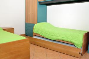 Łóżko lub łóżka w pokoju w obiekcie Residenza San Rocco