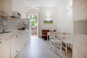 a kitchen with a table and a dining room at Garibaldi 54 in Bari