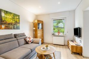 a living room with a couch and a table at Ferienwohnung Gerke in Warstein
