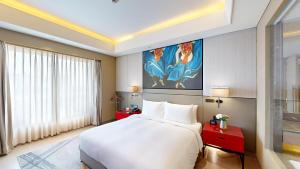 Giường trong phòng chung tại Radisson Blu Faridabad
