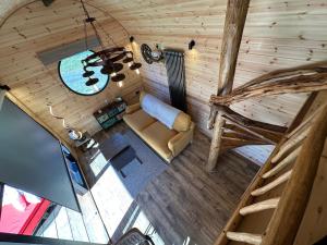 an overhead view of a living room in a log cabin at Scranton luxury fishing pod with private fishing Jetty in Spilsby
