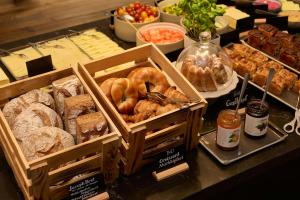 a buffet of different types of bread and pastries at The Cloud One Wien-Staatsoper in Vienna