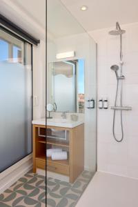 a bathroom with a sink and a shower at Best Western Arcachon Le Port in Arcachon