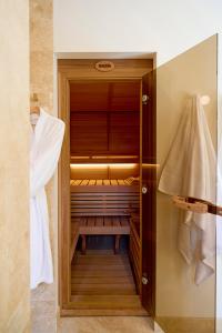 a wooden walk in closet with a bench in it at The Vale Penrose in Penrose +64 photos