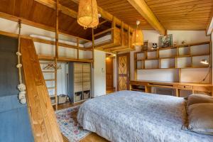 a bedroom with a bed in a room with wooden ceilings at Villa dans Site Exceptionnel in Mourèze +32 photos