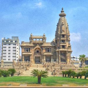a large building with a tower on top of it at new Villa117 in Cairo