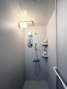 a bathroom with a shower with a shower head at Hotel Suite 2 in Warabi +16 photos