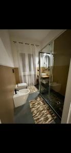 a bathroom with a sink and a toilet and a mirror at Il Ritrovo dei Sogni in Palazzolo Vercellese