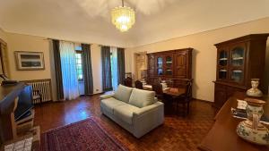 a living room with a couch and a table at Cascinotto Stella Silvia in Piossasco