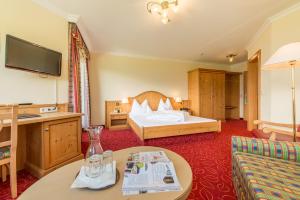 Postel nebo postele na pokoji v ubytování Hotel Jägerhof