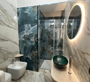 a bathroom with a sink and a mirror at Il Giardino del Sol in San Vito lo Capo +35 photos