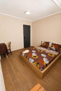 a bedroom with a large bed in a room at Soleya in Antananarivo