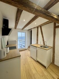 a kitchen with a sink and a counter top at Ferienscheune Rheingoldhof in Sankt Goar