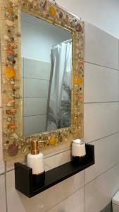 a mirror on a wall in a bathroom at Casa di Nonno in Alikanas +45 photos