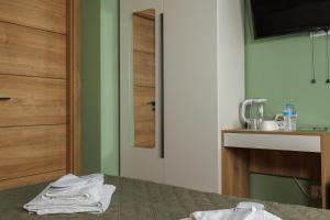 a bathroom with a bed with towels on it at Vita Verde in Torrevieja +41 photos
