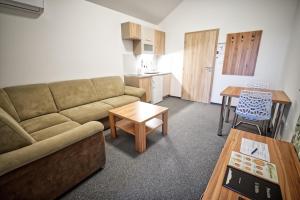 a living room with a couch and a table at U Jeřába - komplex C in Horní Věstonice