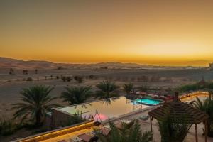 a view of the desert from a hotel in the desert at Hotel Riad Xaluca in Merzouga