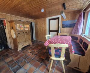 a table in a room with a table and chairs at Zum fröhlichen Eichhörnchen in Feldberg +28 photos