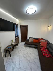a living room with a couch and a flat screen tv at Casa Alba in Chioggia