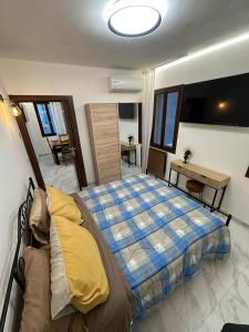 a bedroom with a bed and a couch in it at Casa Alba in Chioggia