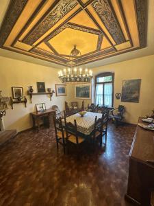 a dining room with a table and a ceiling at Villa Elisabetta in Malcesine