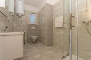 Ein Badezimmer in der Unterkunft Apartmani Gaube