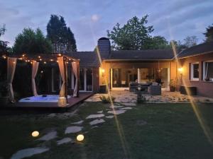 a backyard of a house with a patio at Natur Spa Haus in Niederkrüchten