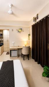 a bedroom with a desk and a chair in a room at Hidden house stay in Mathura