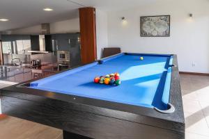 a pool table with balls on top of it at Casa de Freixo Casa de Freixo Refugio Tranquilo na Natureza in Ponte de Lima