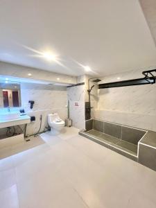 a bathroom with a toilet and a sink at patong sunset villa Phuket in Patong Beach