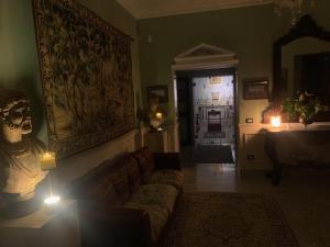 a living room with a couch and a doorway with lights at b&b Antiche Dimore Taurasi in Taurasi