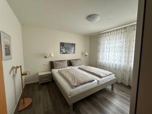 Llit o llits en una habitació de Hotel Garni Café Räpple