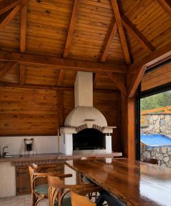 a kitchen with an outdoor oven in a house at Srce Tornika, Tornik-Zlatibor in Tornik