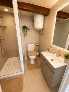 a bathroom with a toilet and a sink and a shower at Republic Stay in Valletta