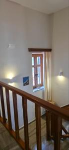 a room with a staircase and a window at Hotel Adonis in Mythimna