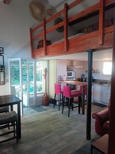 a kitchen and dining room with a loft bed at Chez Delph in Rognonas