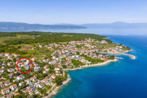 a small island in the ocean with a red circle at Villa Sarah in Vantačići