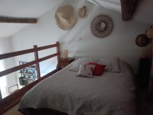a bedroom with a bed with a stuffed animal on it at Chez Delph in Rognonas