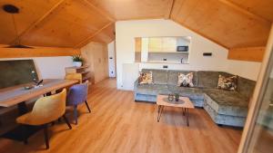 a living room with a couch and a table at Residence Krone in Schenna