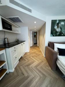 a room with a kitchen and a living room at Noa's Place in Eilat