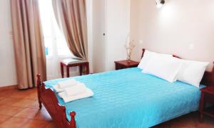 Postel nebo postele na pokoji v ubytování Ostria Eressos Rooms