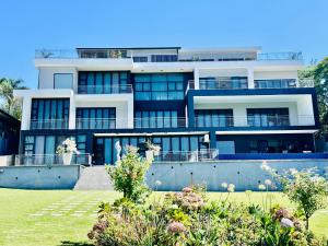 a large white building with a lot of windows at H & H Boutique & SPA in Roodepoort