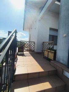 a balcony of a building with a railing and stairs at Vivi Conero in Ancona