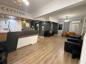a lobby with a reception desk and couches in a building at Otel DENİZYILDIZI CENTRUM in Fethiye