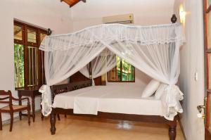 Tempat tidur dalam kamar di Villa Helvetia