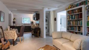 a living room with a couch and a dining room at VILLA CORONA 8, Emma Villas in Cattolica